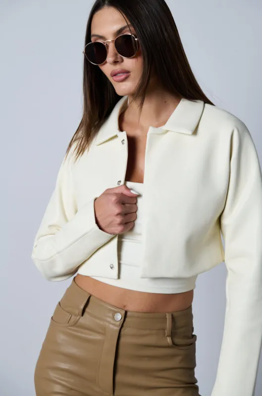 DRESSY CROPPED FAUX LEATHER BLAZER IN IVORY sold by AKIRA
