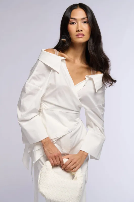BILLY OFF THE SHOULDER WRAP FRONT BLOUSE sold by AKIRA
