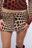 ABLE TO SEE MINI SKIRT IN BROWN MULTI sold by AKIRA