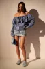 OFF SHOULDER PATCHWORK DENIM JACKET sold by AKIRA