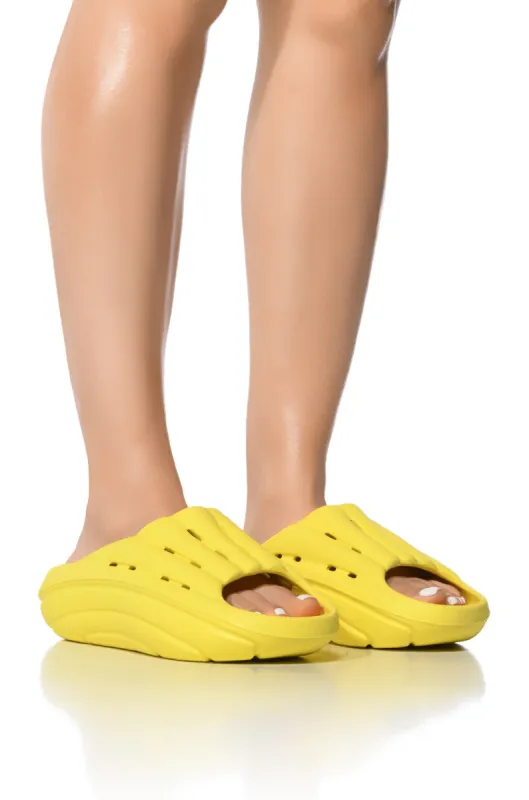 UGG FOAMO SLIDE IN YELLOW sold by AKIRA