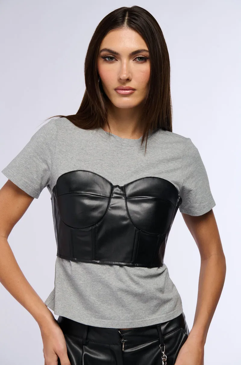 GOT ME TWISTED T SHIRT WITH FAUX LEATHER CORSET DETAIL sold by AKIRA