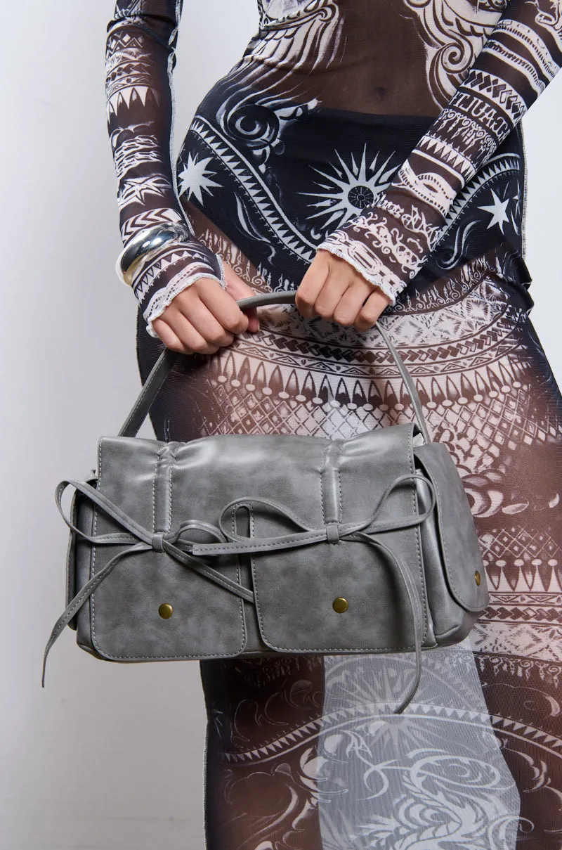 IYKYK PU BOW PURSE sold by AKIRA