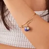 Globe Charm Bangle Bracelet sold by Alex and Ani