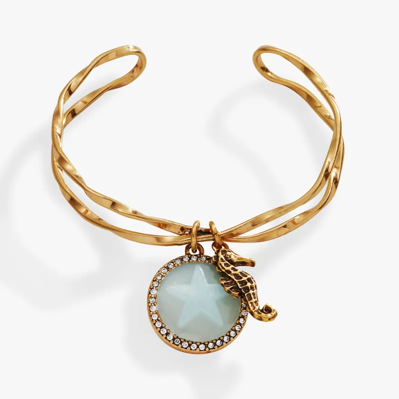Seahorse + Sand Dollar Twisted Cuff sold by Alex and Ani