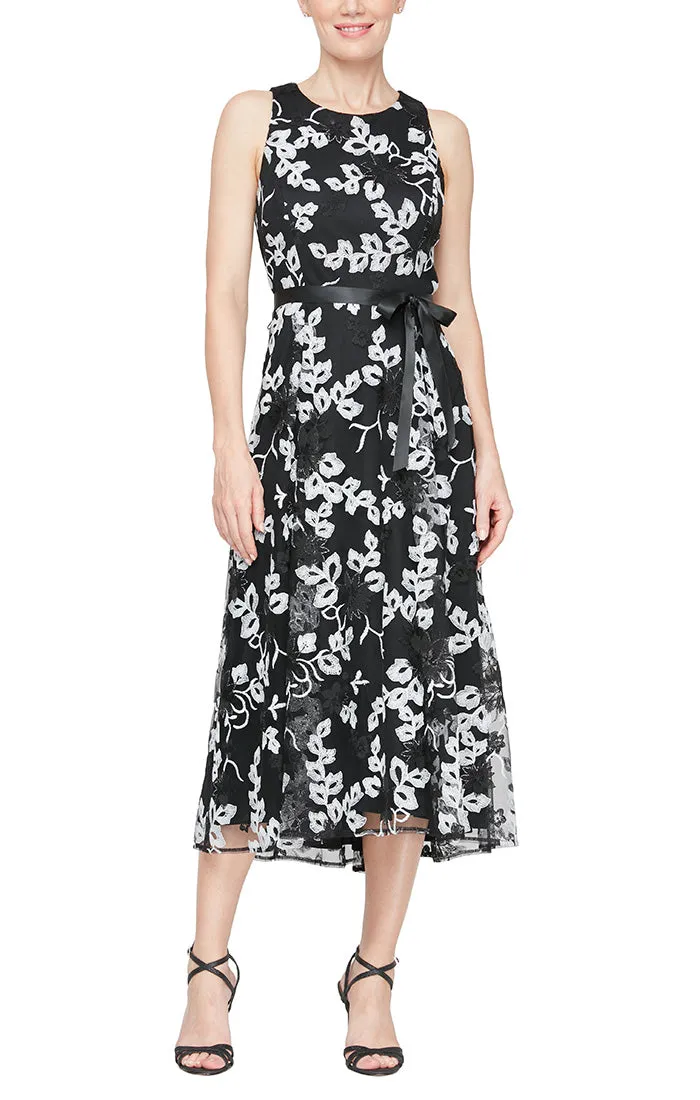 Regular - Sleeveless Embroidered Stretch Tulle Dress with High/Low Hem & Tie Belt sold by Alex Evenings