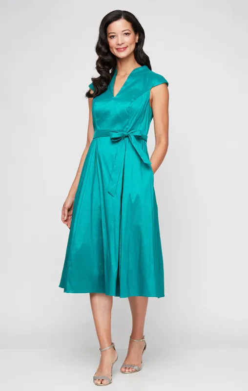 Petite Short V-Neck Stretch Taffeta Dress with A-Line Skirt and Tie Waist Detail sold by Alex Evenings