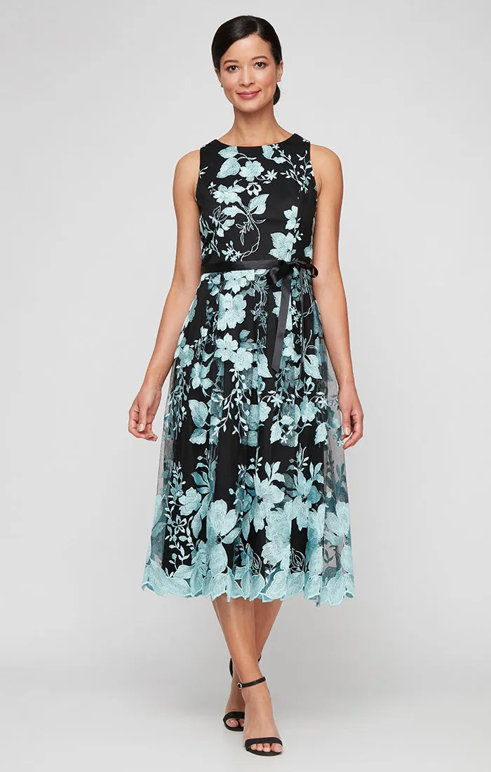 Midi Length Sleeveless Embroidered Dress With Full Skirt and Tie Belt sold by Alex Evenings