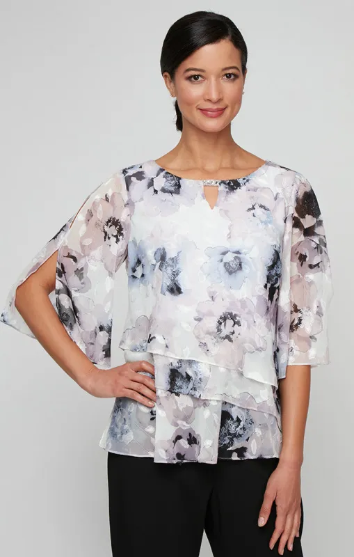 Printed Chiffon Burnout Blouse with Asymmetric Tier Hem Detail and Embellished Cutout Neckline sold by Alex Evenings