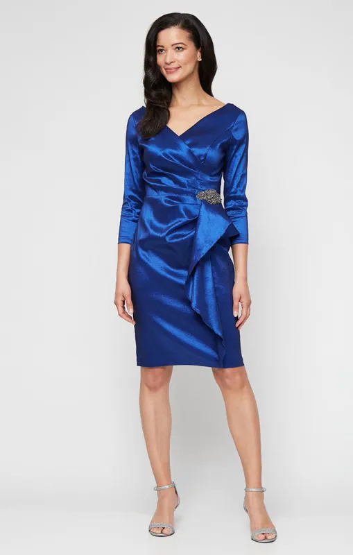 Short Stretch Taffeta Sheath Dress with Surplice Neckline, Cascade Skirt and Embellishment Detail at Hip sold by Alex Evenings