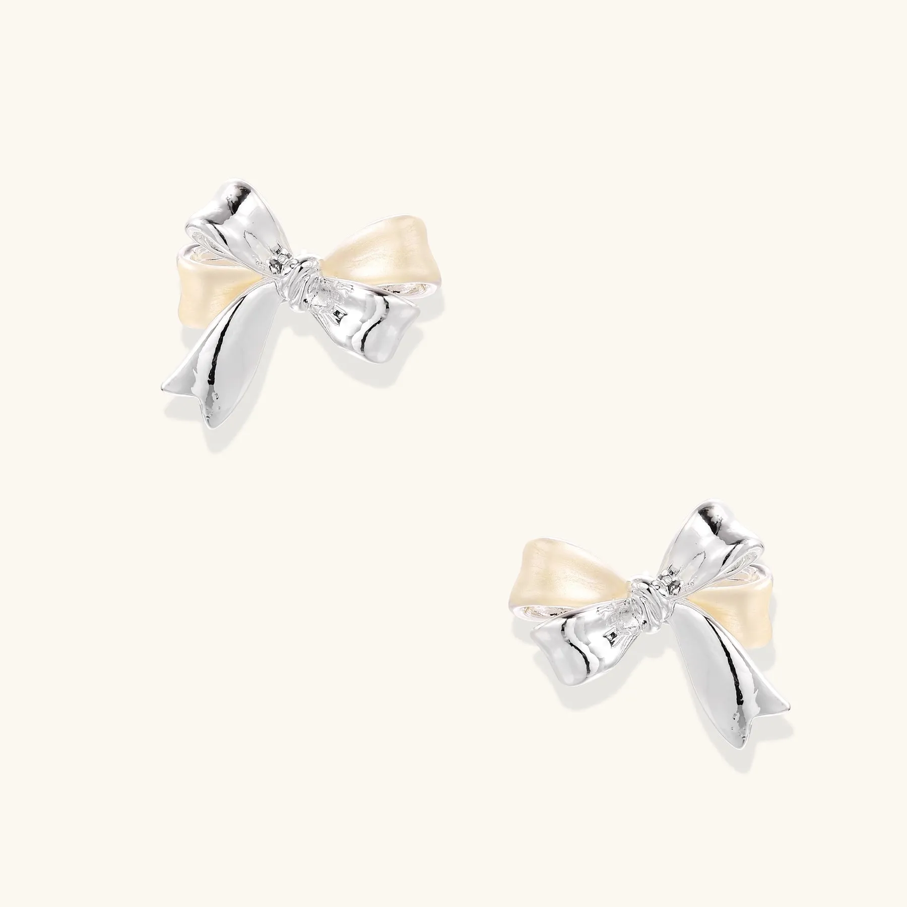 Pearl Bow Studs sold by Alex Evenings
