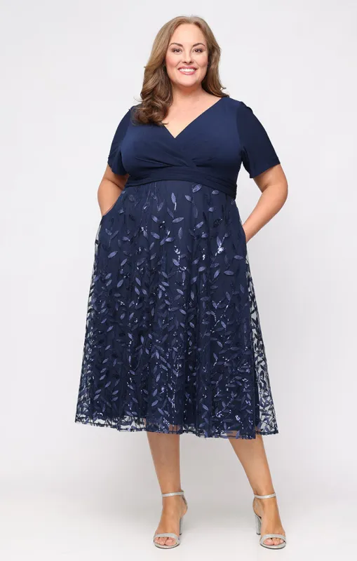 Plus Tea Length Embroidered A-Line Dress with Matte Jersey Surplice Neckline, Ruched Empire Waist and Elbow Sleeves sold by Alex Evenings