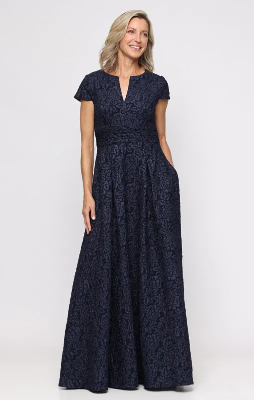 Long Embossed Crepe Ballgown with Cap Sleeves, Notched Neckline Detail and Pockets sold by Alex Evenings