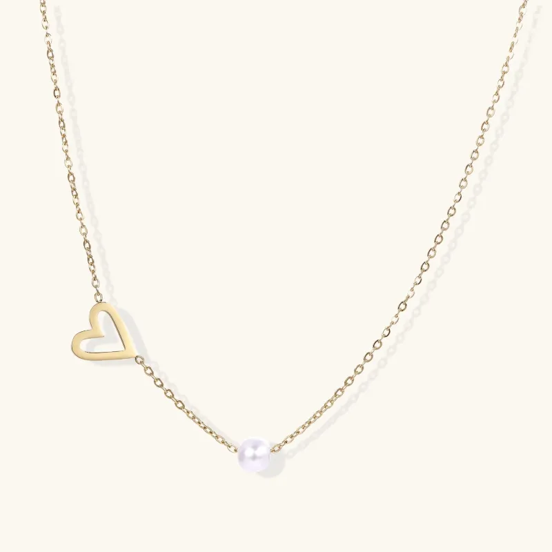 Pearl Heart Embrace Necklace made by Alex Evenings