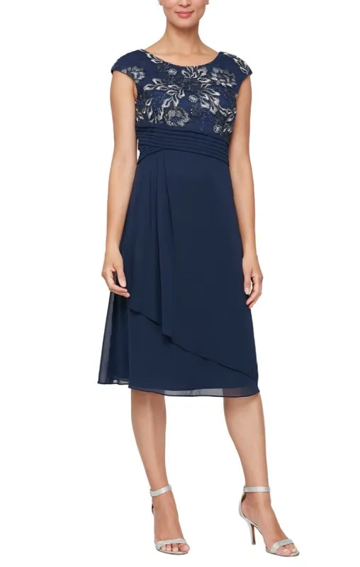 A-Line Stretch Tulle Dress with Embroidered Empire Bodice, Pleated Detail & Cascade Skirt sold by Alex Evenings
