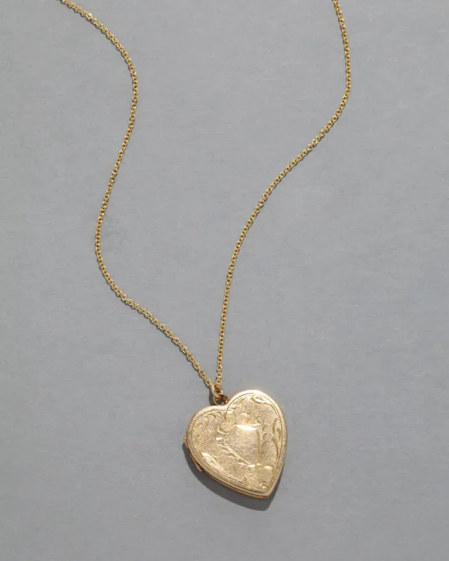 Antique 1920s 14k Gold Etched Heart Locket Necklace sold by Alexis Bittar