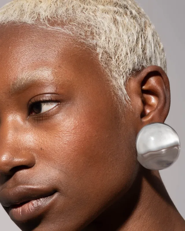 Liquid Lucite Orb Clip Earring- Polished Silver sold by Alexis Bittar