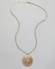 Antique 1890s 14k Gold Filled Art Nouveau Floral Pattern Locket Necklace sold by Alexis Bittar