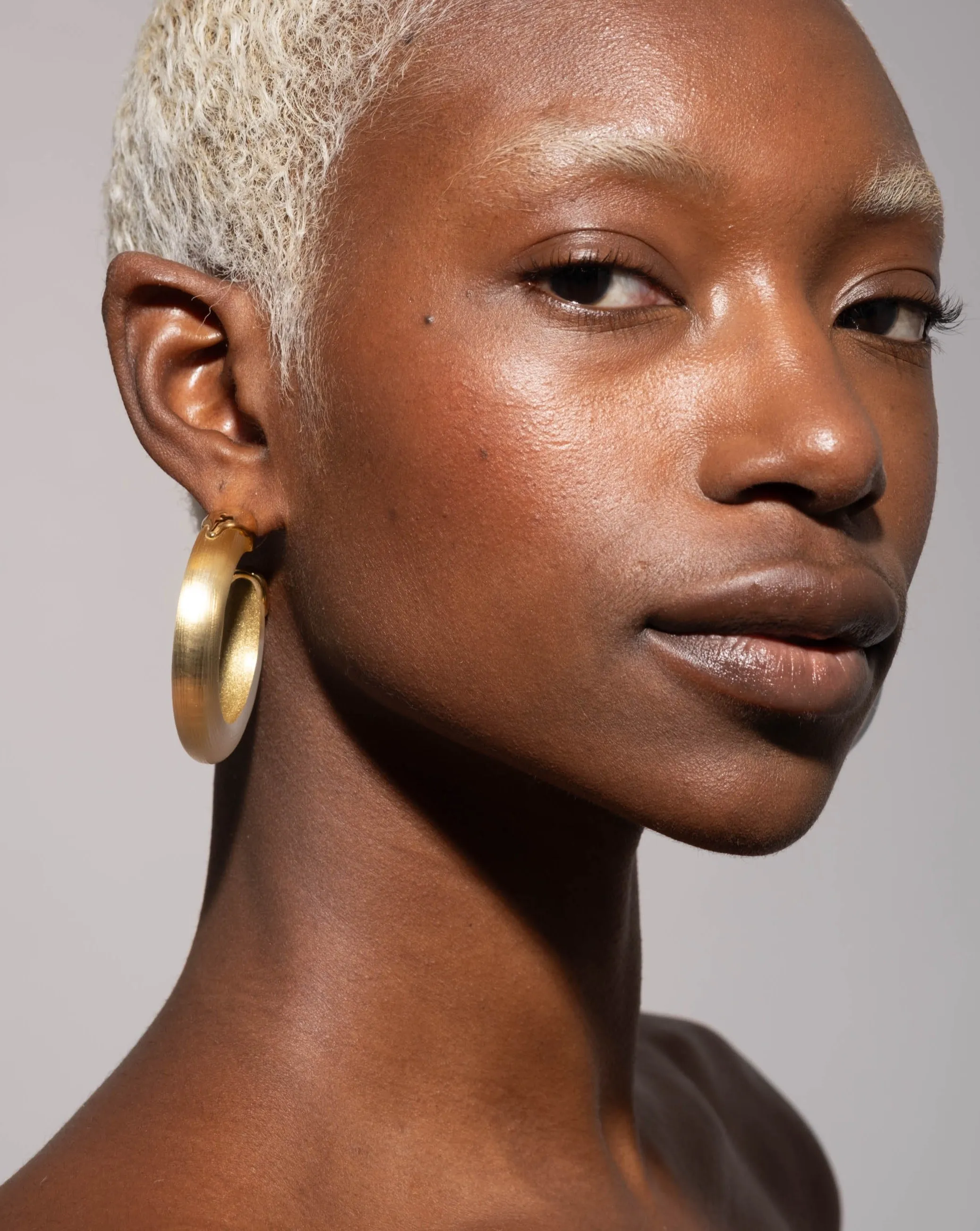 Luminous Lucite Gold Dipped Hoop Earring- Gold sold by Alexis Bittar