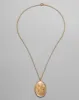Antique 1920s 14k Gold Filled Hand Etched Floral Oval Locket Necklace sold by Alexis Bittar