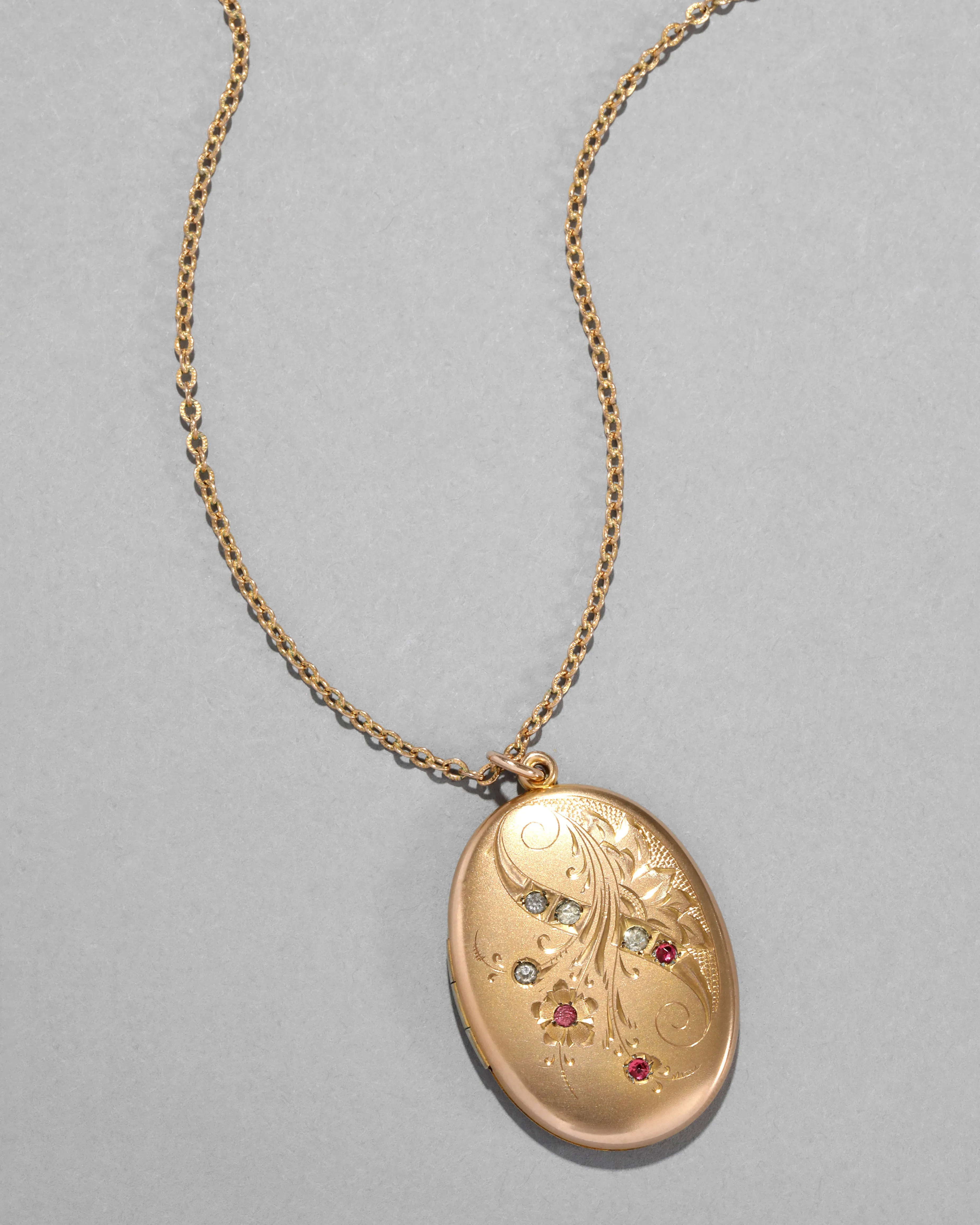 Antique 1920s 14k Gold Filled Hand Etched Floral Oval Locket Necklace sold by Alexis Bittar