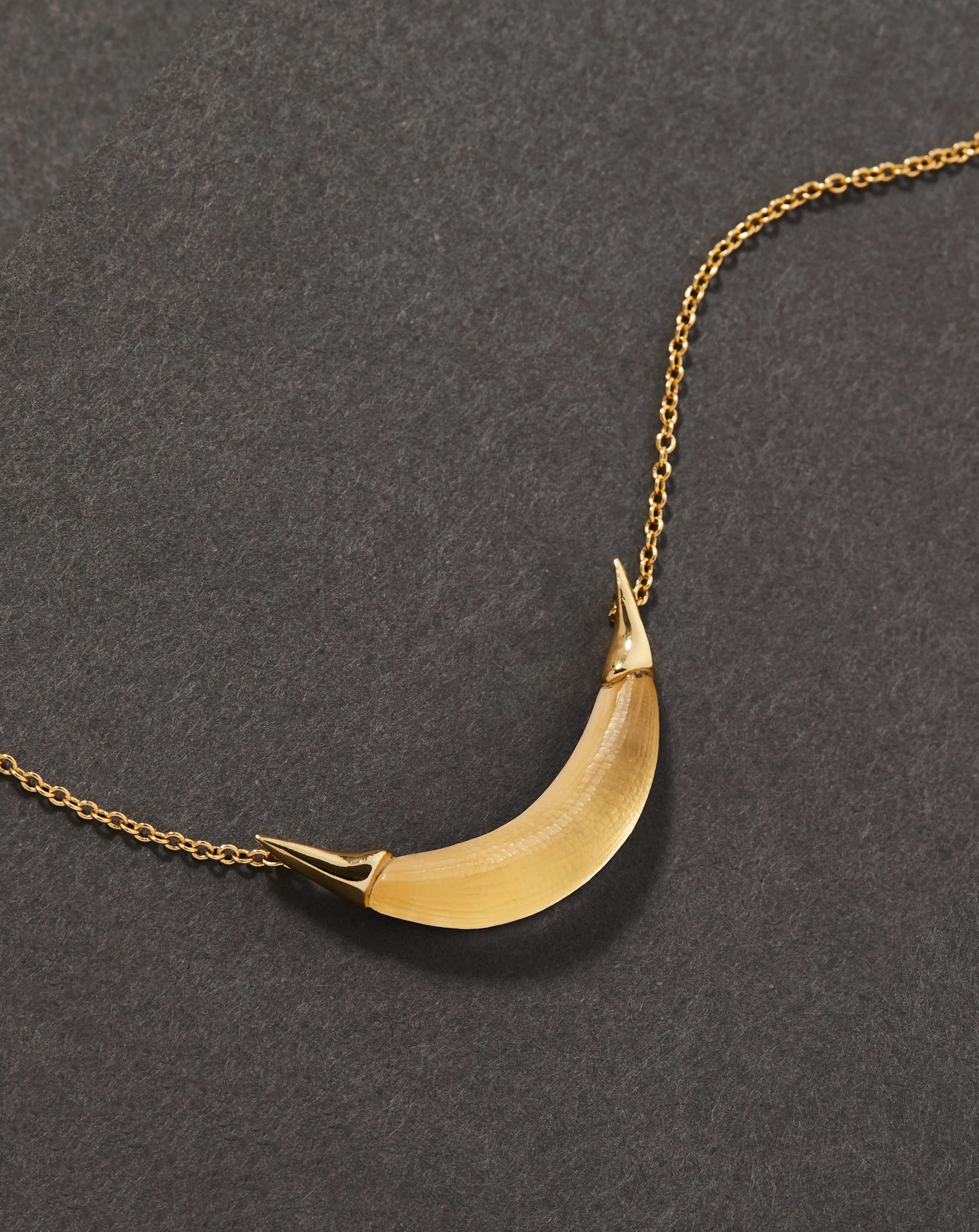Gold Capped Crescent Lucite Necklace- Gold sold by Alexis Bittar