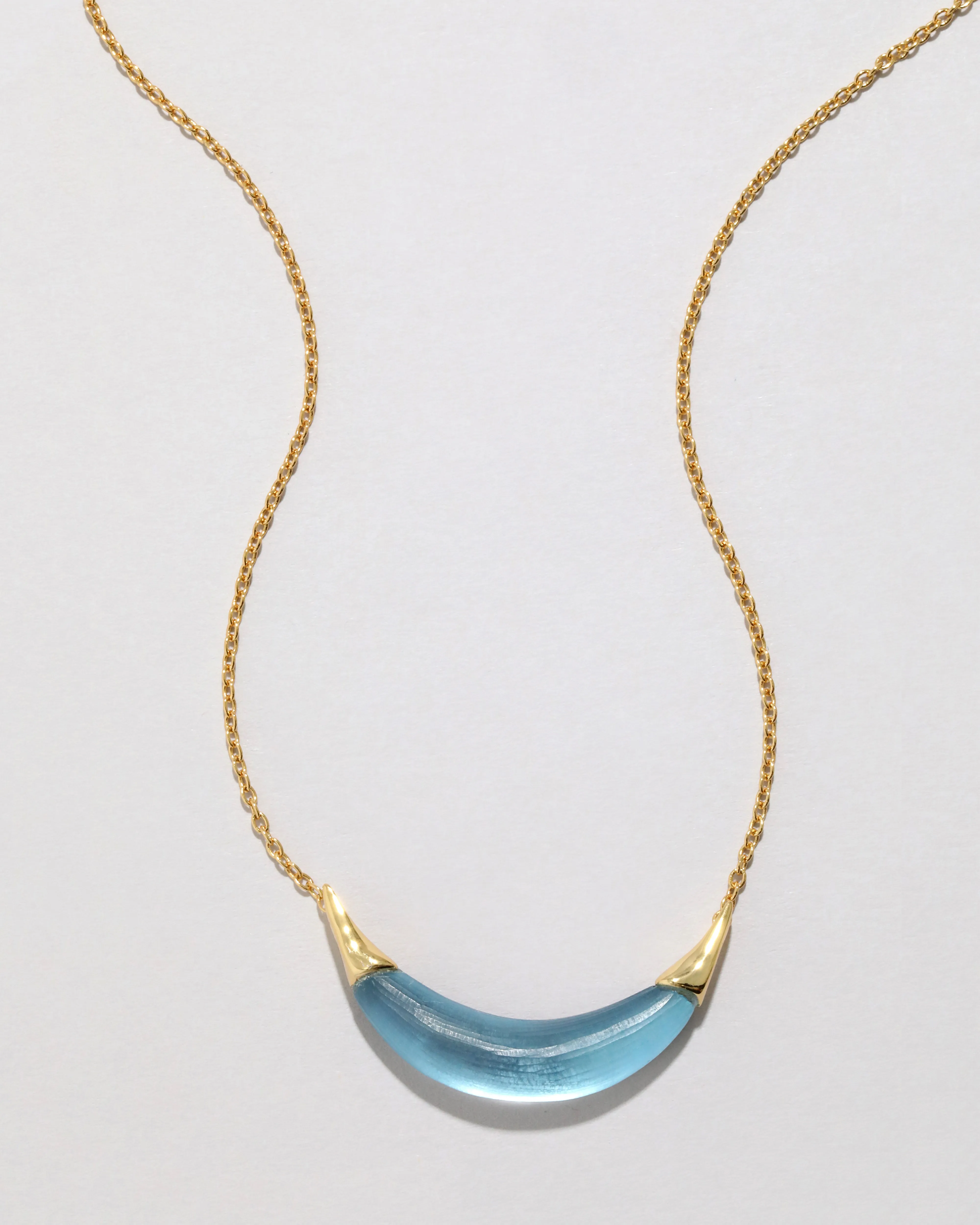 Gold Capped Crescent Lucite Necklace- Bermuda Blue sold by Alexis Bittar