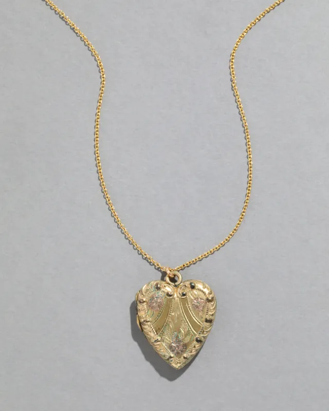Vintage 1950s 10k Gold FIlled Scrolling Heart Locket Necklace sold by Alexis Bittar