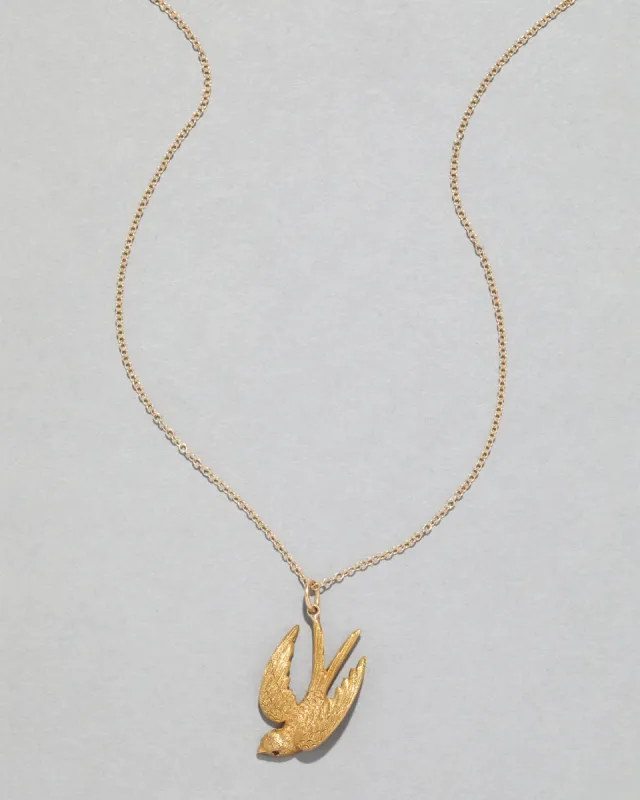 Antique 1900s 14k Gold Hand-Etched Soaring Bird with Ruby Eye Pendant Necklace sold by Alexis Bittar