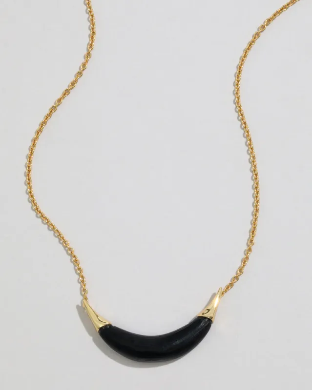 Gold Capped Crescent Lucite Necklace- Black sold by Alexis Bittar
