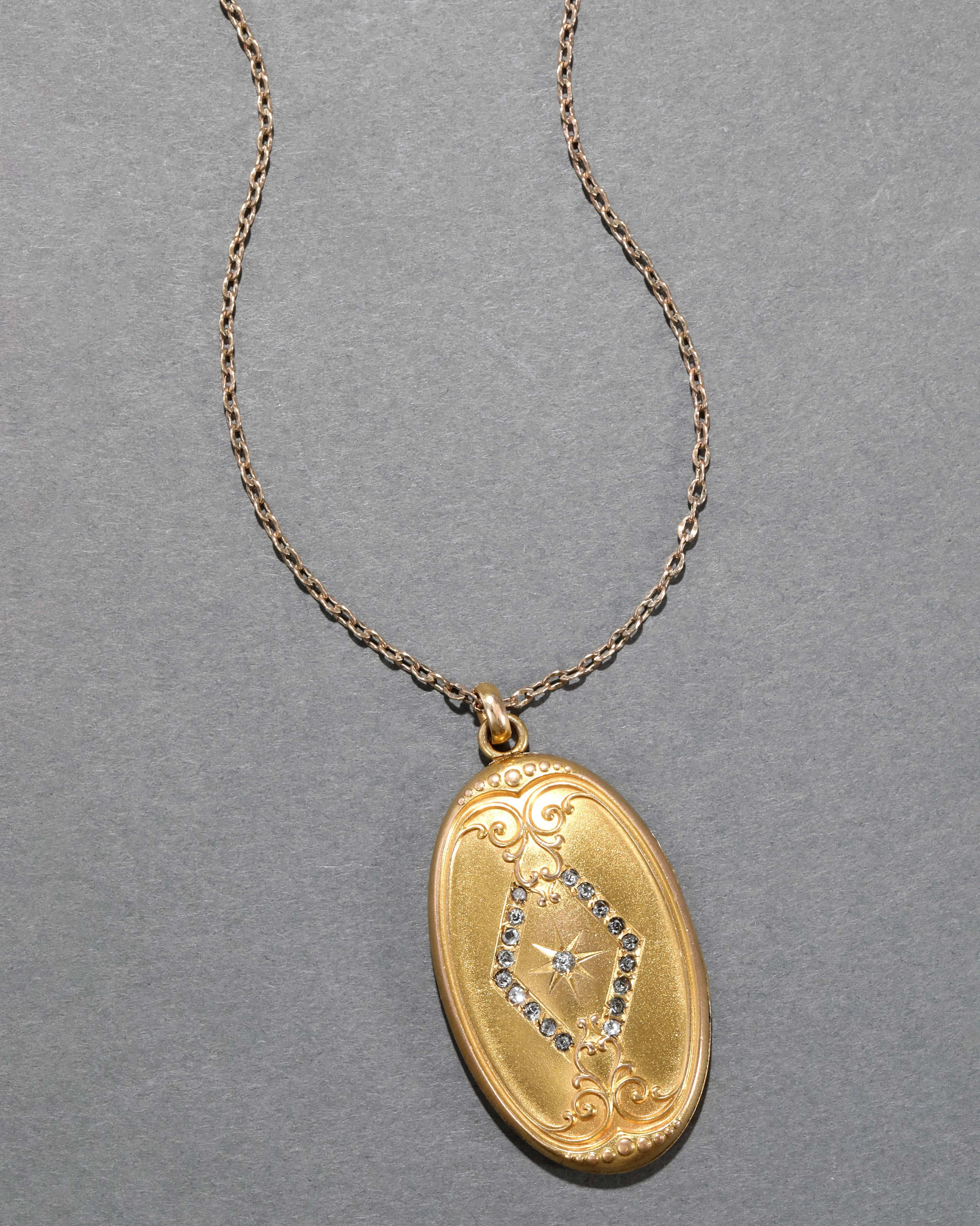 Antique 1920s 14k Gold Filled Crystal Star Center Oval Locket Necklace sold by Alexis Bittar