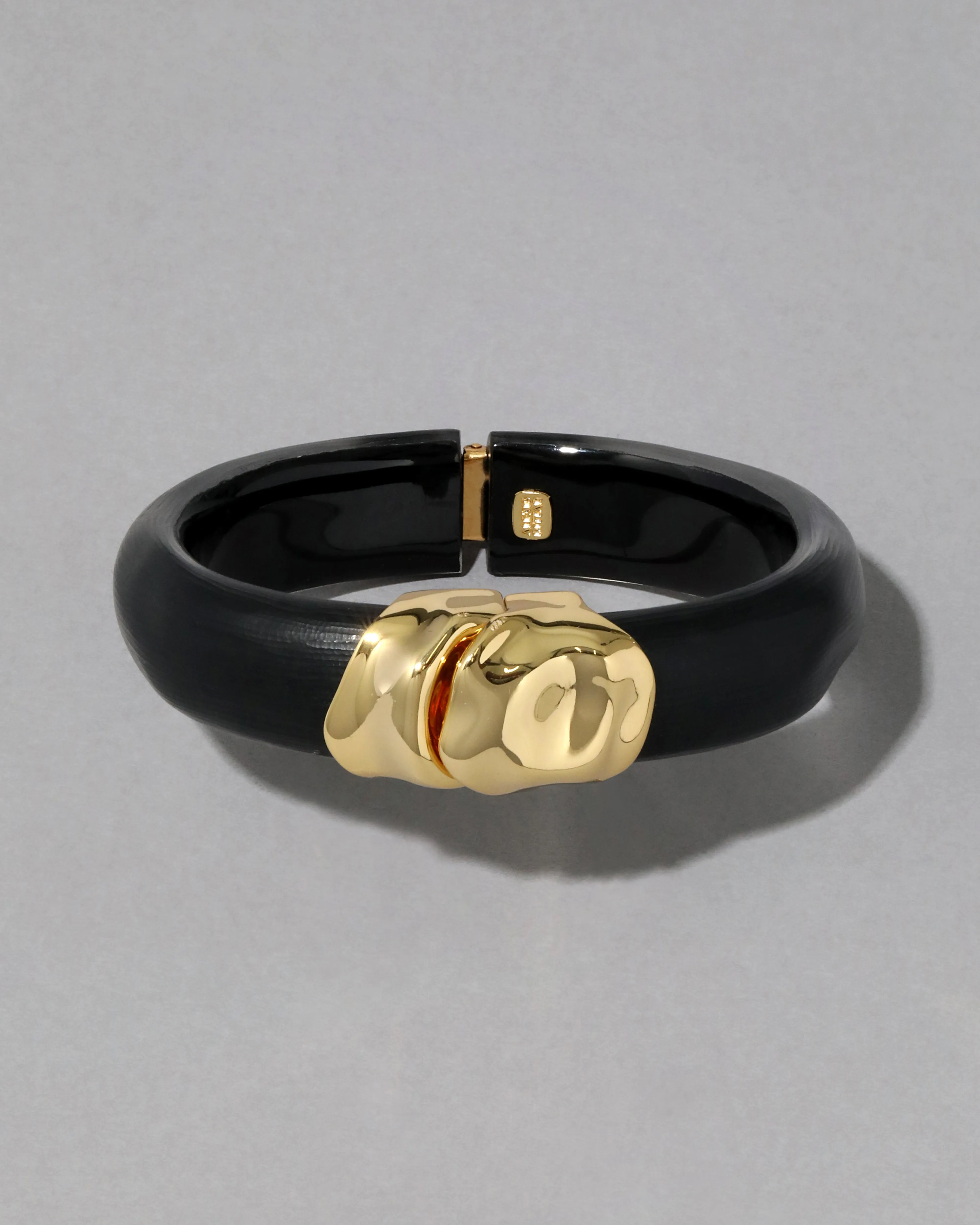 Molten Gold Lucite Hinge Bracelet- Black sold by Alexis Bittar
