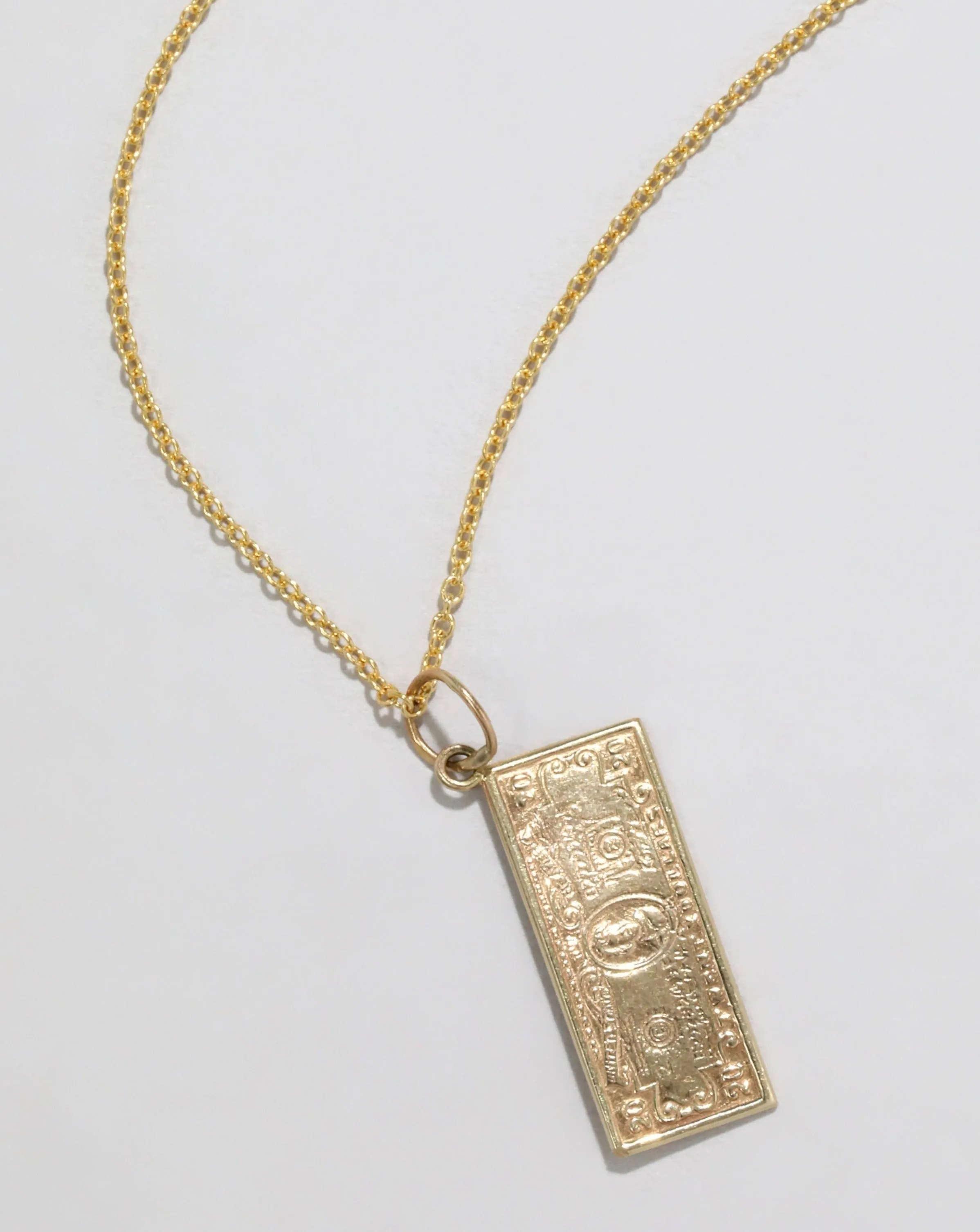 Vintage 1970s 14k Gold Handmade Dollar Pendant Necklace sold by Alexis Bittar