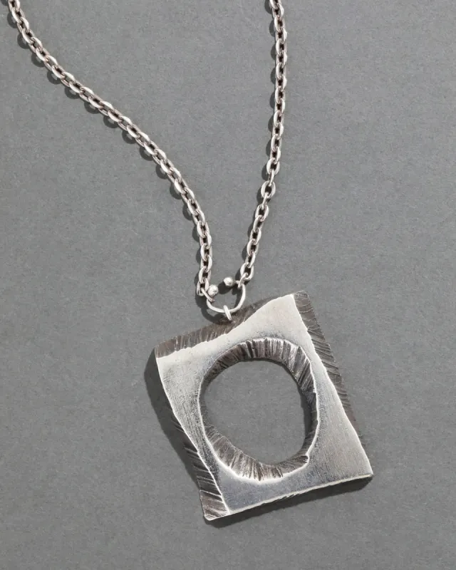Vintage 1970s Brutalist Sterling Silver Handmade Crater Pendant Necklace sold by Alexis Bittar