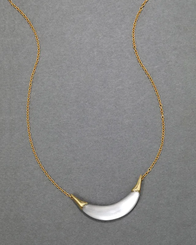 Gold Capped Crescent Lucite Necklace- Pewter sold by Alexis Bittar