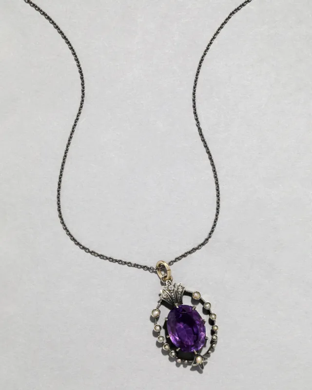 Antique 1800s Sterling Silver Amethyst Pendant with Pearl Halo sold by Alexis Bittar