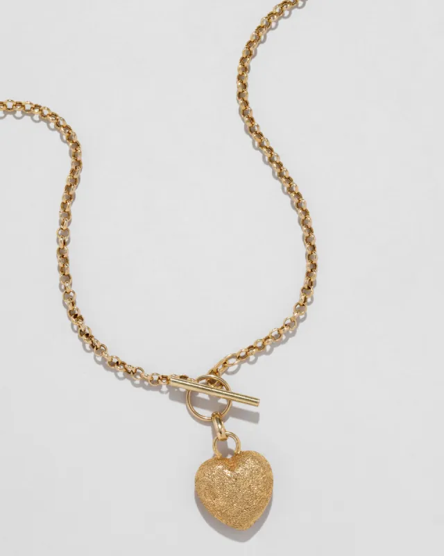 Vintage 1960s 14k Gold Handmade Puffy Textured Heart Pendant Necklace with Toggle Closure sold by Alexis Bittar