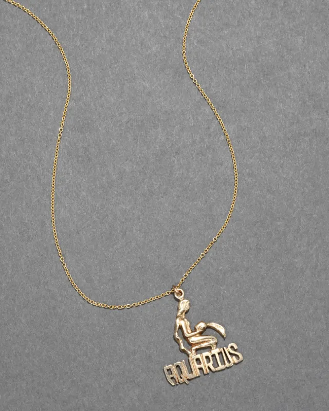 Vintage 1970s 14k Gold Aquarius Zodiac Pendant Necklace sold by Alexis Bittar