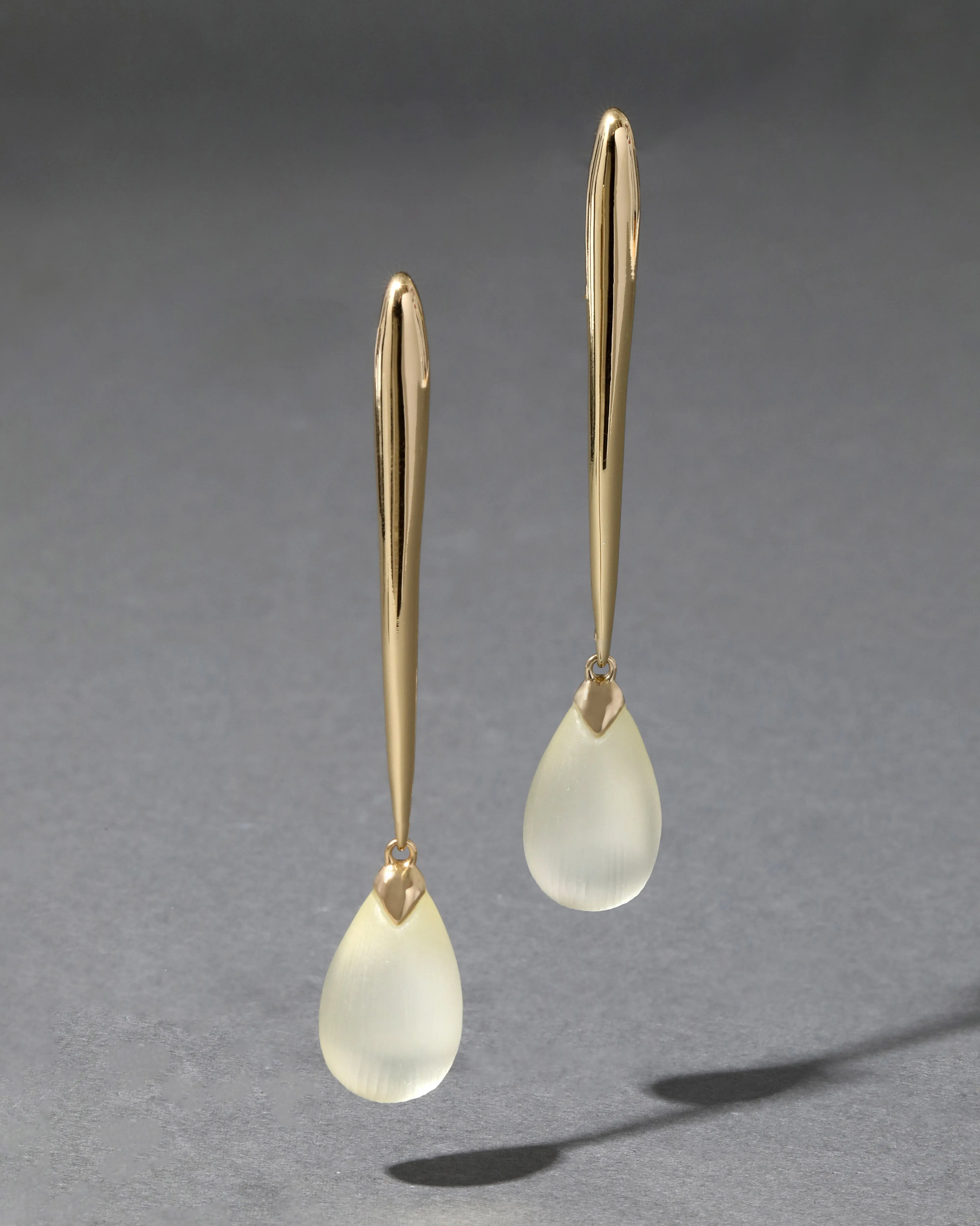 Molten Gold Elongated Lucite Drop Earring- Cream sold by Alexis Bittar