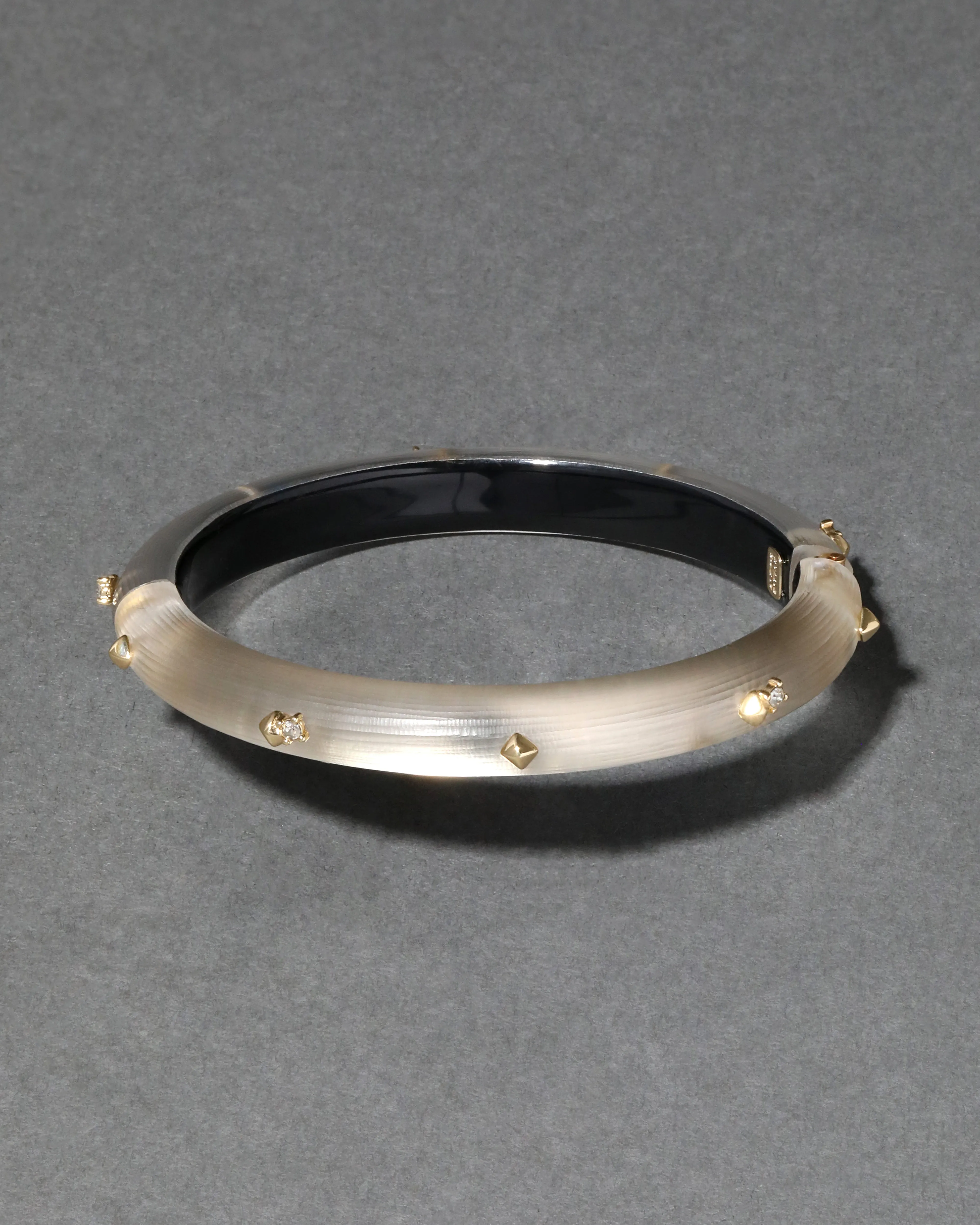 Rocky Gold Studded Lucite Hinge Bracelet- Warm Grey sold by Alexis Bittar