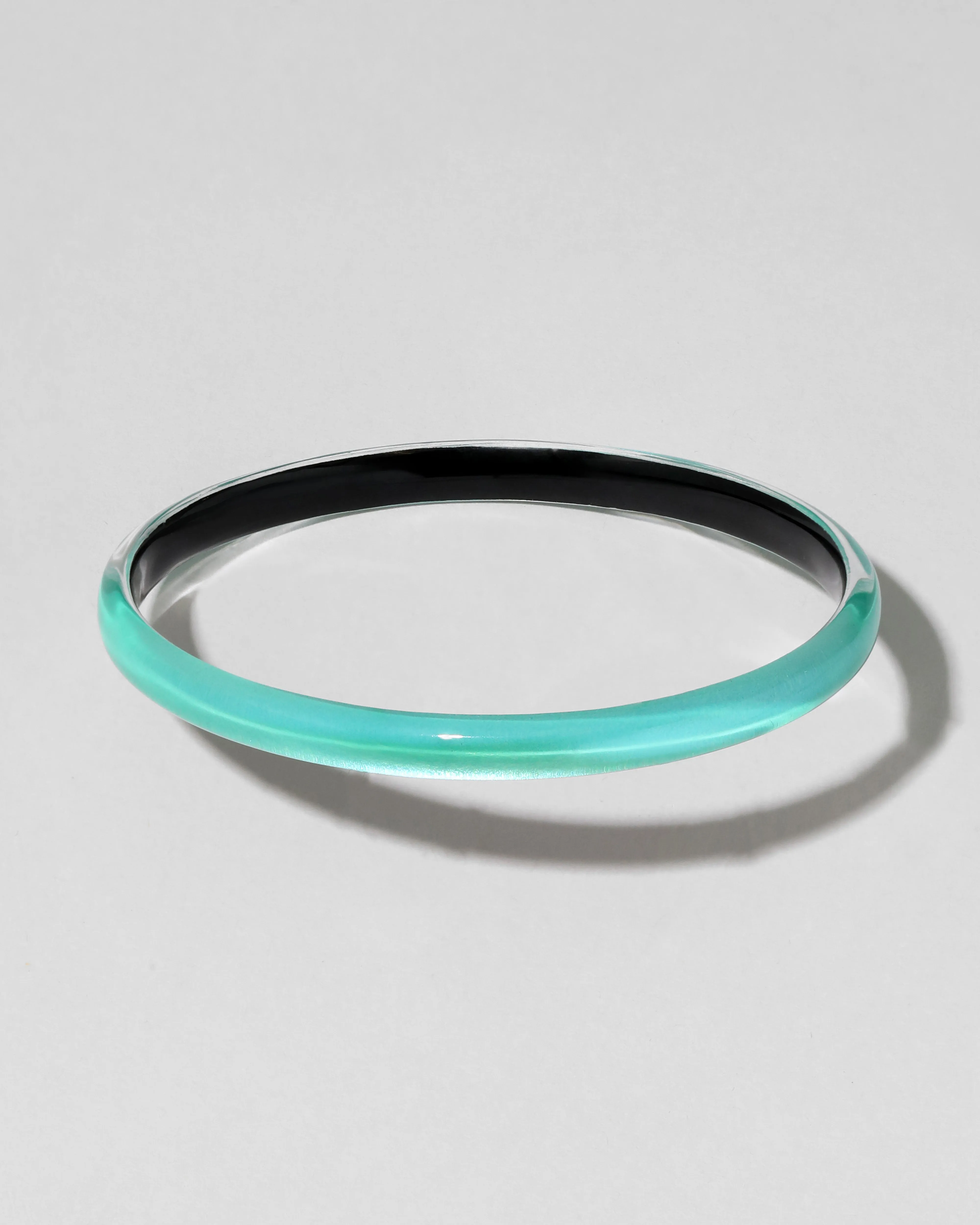 Luminous Lucite Super Skinny Bangle Bracelet- Mediterranean Opal sold by Alexis Bittar