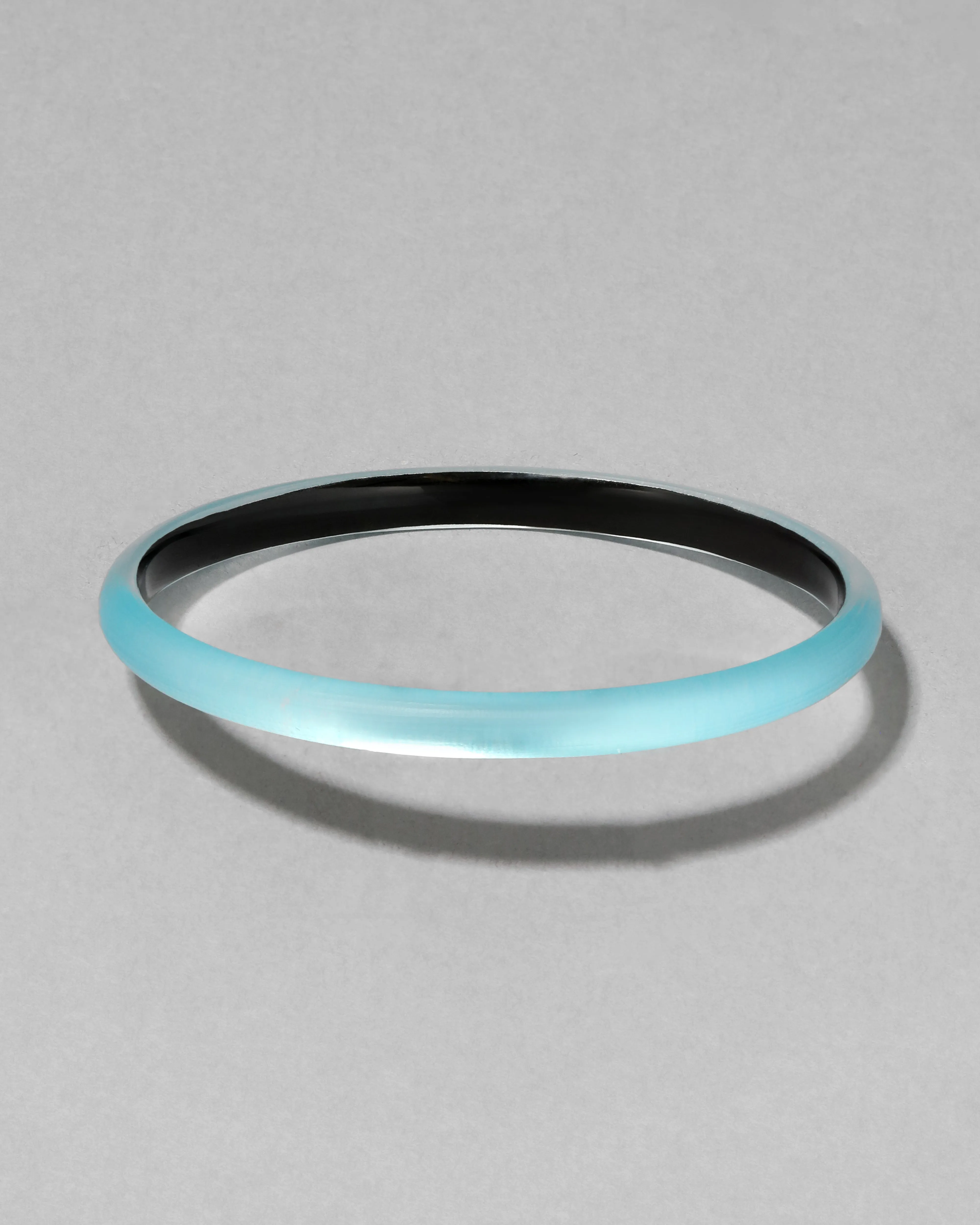 Luminous Lucite Super Skinny Bangle Bracelet- Icy Blue sold by Alexis Bittar