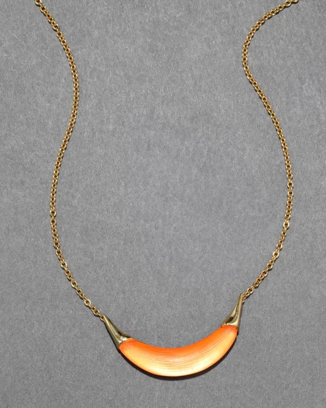 Gold Capped Crescent Lucite Necklace- Neon Orange sold by Alexis Bittar