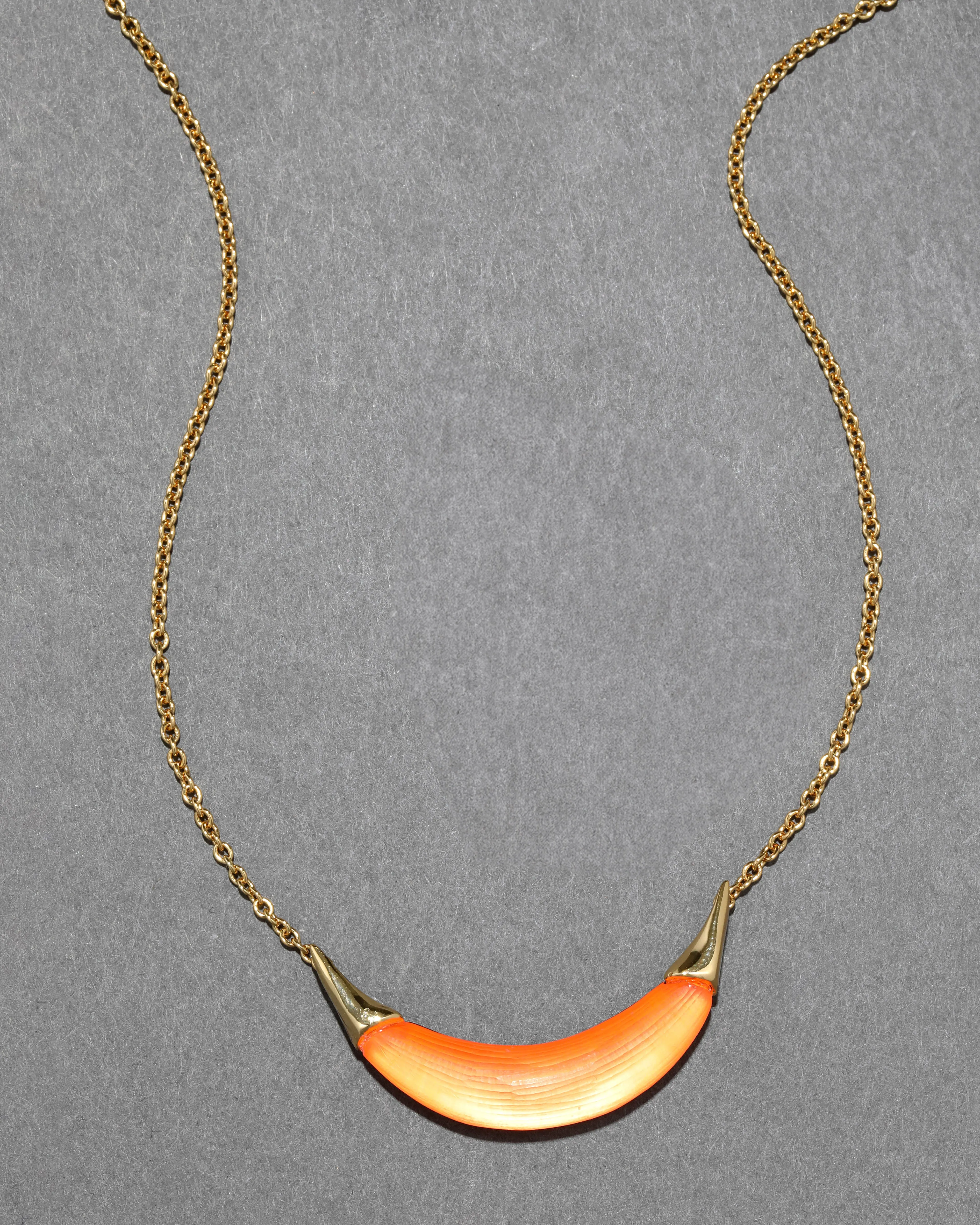 Gold Capped Crescent Lucite Necklace- Neon Orange sold by Alexis Bittar