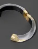 Luminous Lucite Claw Hinge Bracelet- Silver sold by Alexis Bittar