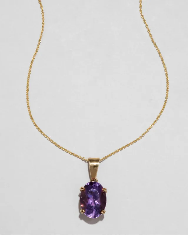 Vintage 1960s 14k Gold Prong Set Amethyst Pendant Necklace with Gold Bale sold by Alexis Bittar