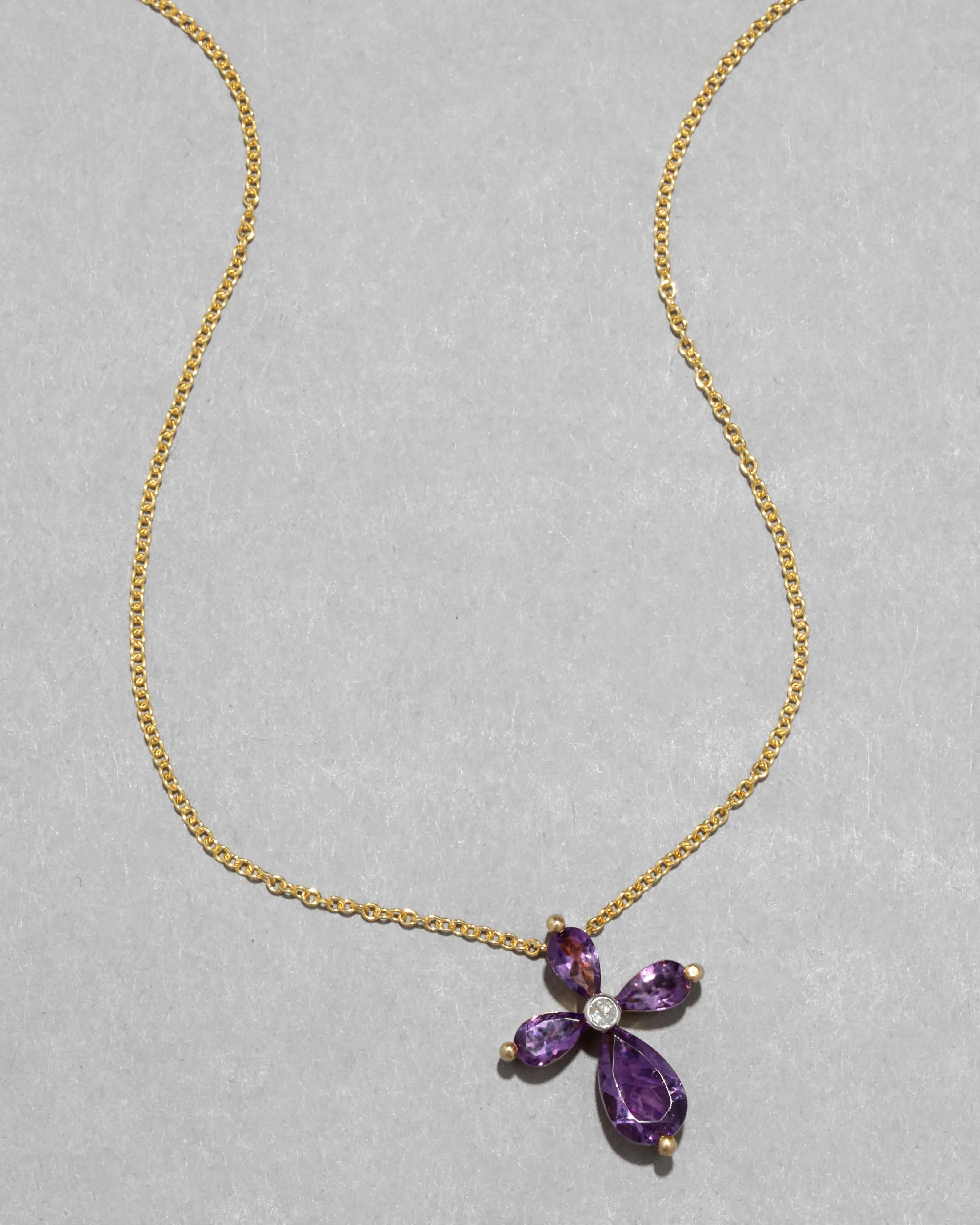Vintage 1980s 10k Gold Pear Cut Amethyst Cross with Diamond Center Pendant Necklace sold by Alexis Bittar