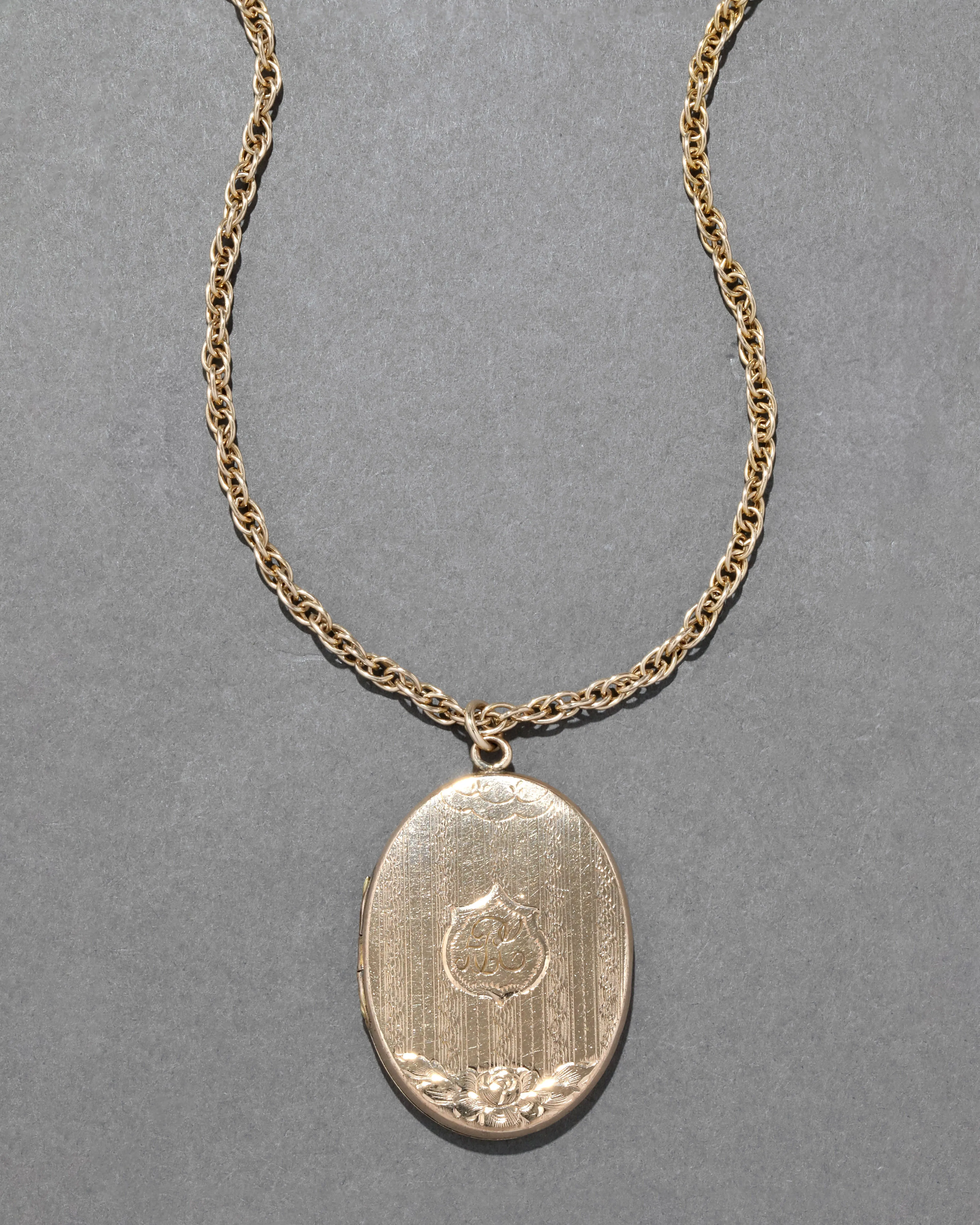 Antique Early 1900s 14k Gold Fill Hand Etched Pattern Oval Locket Necklace sold by Alexis Bittar