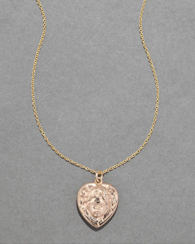 Antique 1920s 14k Gold Fill Engraved Cherub Heart Locket Necklace sold by Alexis Bittar