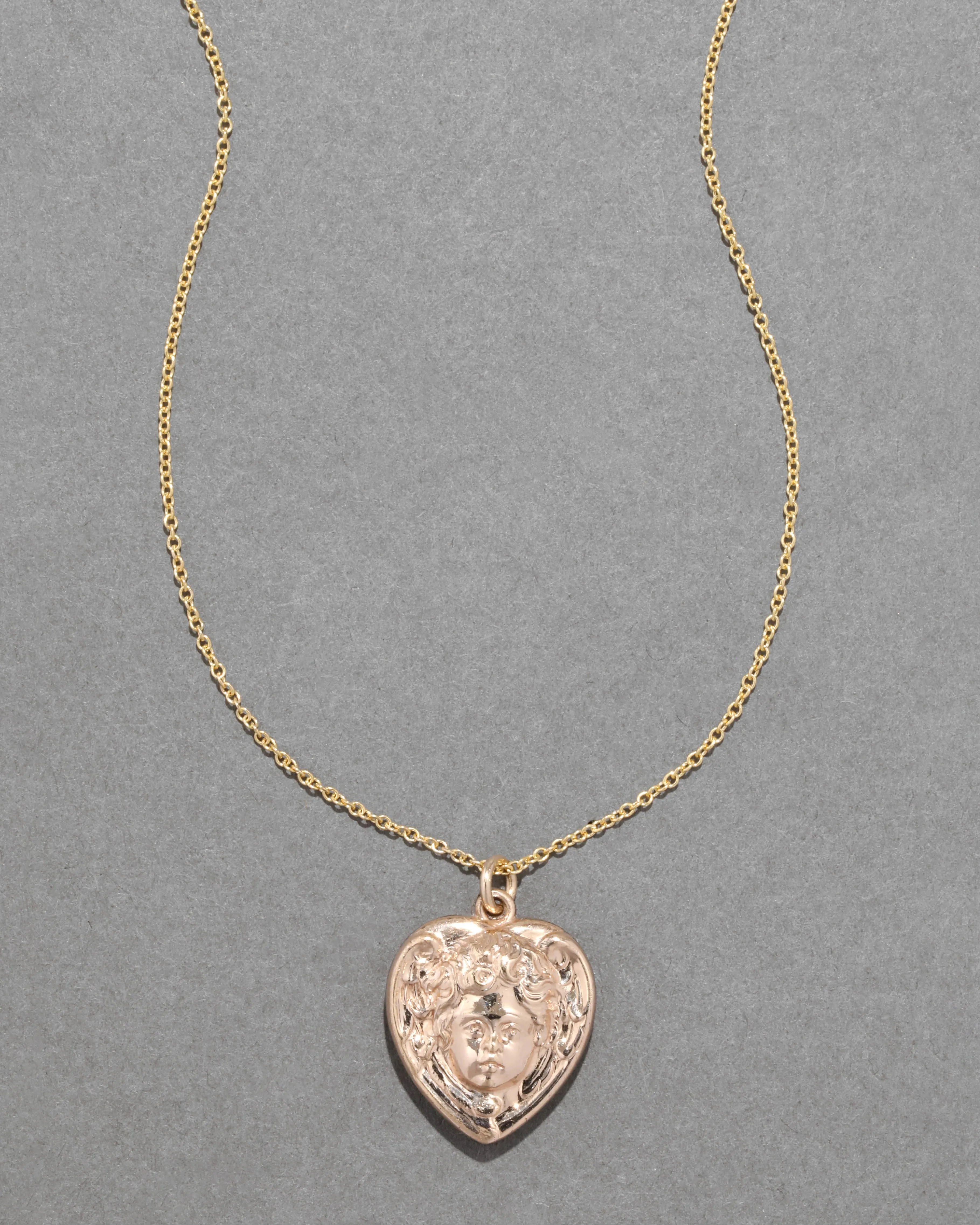 Antique 1920s 14k Gold Fill Engraved Cherub Heart Locket Necklace sold by Alexis Bittar